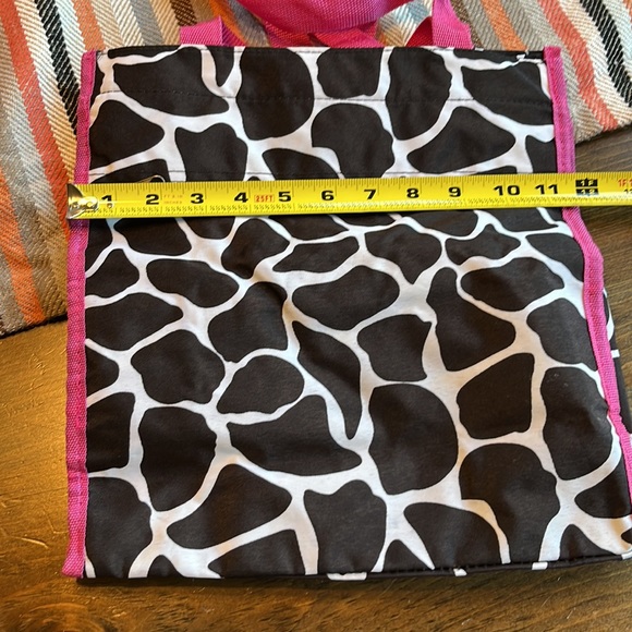 Zebra print bag. Black with pink handle and trim. Used several times. - Picture 5 of 7